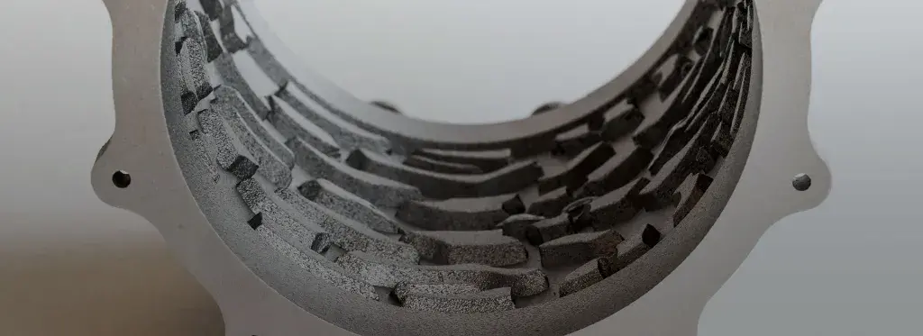 a close up of a 3D printed, metal cooling mantle 