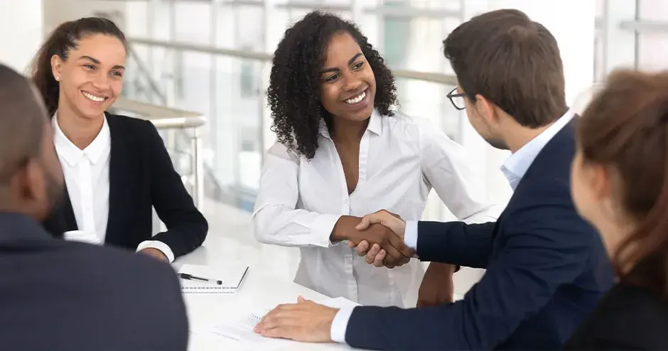 A group of professionals communicating in an office