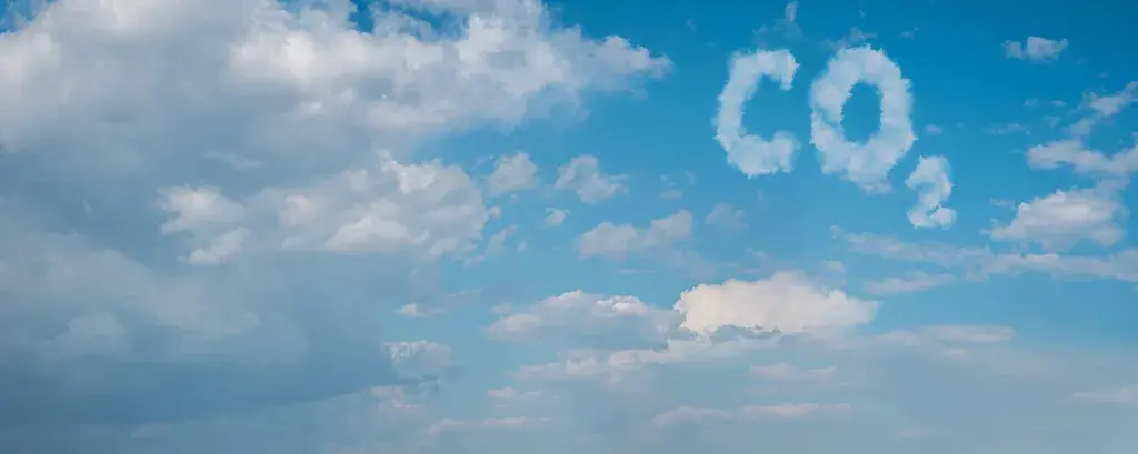 A blues sky with clouds spelling C02